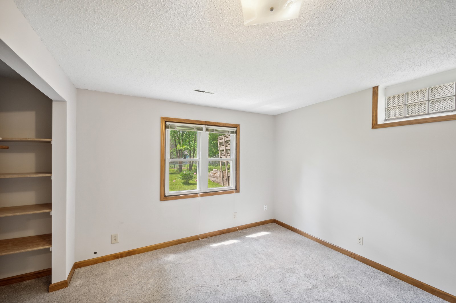 Quiet and serene bedroom at Blossom Hill Assisted Living, Woodbury, MN, with neutral tones and a restful atmosphere